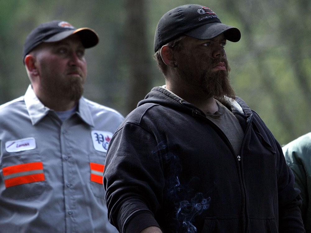 Mine workers stand at the entrance of the Upper Big Branch coal mine.