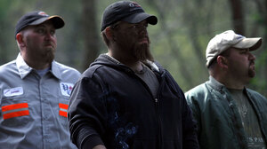 Mine workers stand at the entrance of the Upper Big Branch coal mine on April 9, a few days after an explosion killed 29 men.