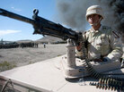 A Mexican soldier stands guard A Mexican soldier stands guard