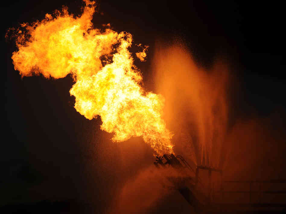Gas from the damaged Deepwater Horizon wellhead is burned by the drill ship Discoverer Enterprise.