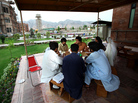 Students chat in an outdoor cafe on the campus of the Institute of Management Sciences. Students chat in an outdoor cafe on the campus of the Institute of Management Sciences.
