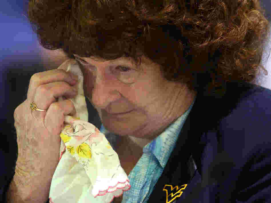 Alice Peters wipes away a tear during her testimony