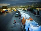 Haiti quake survivors set up camp on busy road median south of Port-au-Prince Haiti quake survivors set up camp on busy road median south of Port-au-Prince