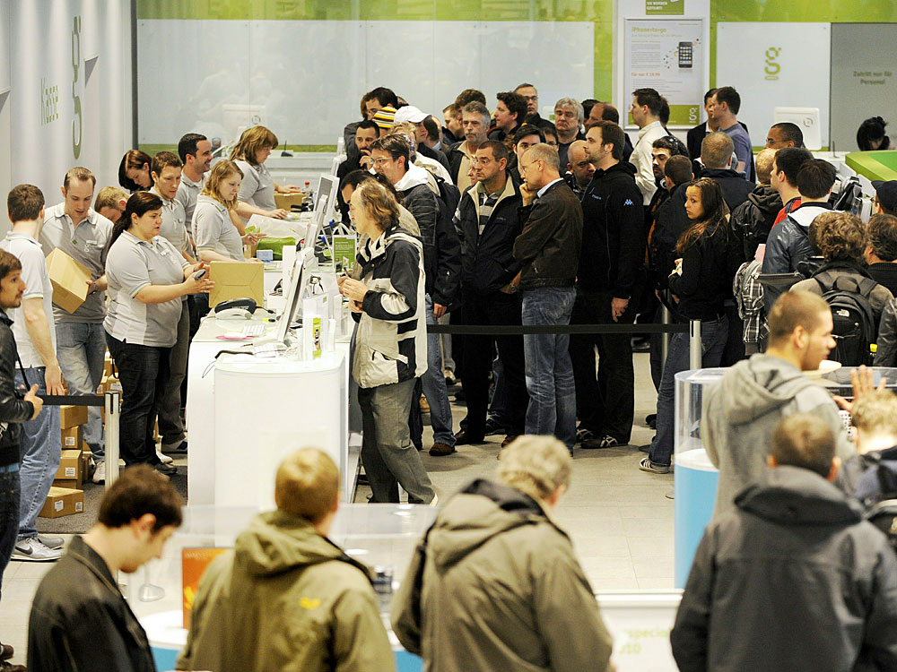 Customers line up Friday to buy Apple's new iPad as it is launched in Berlin.
