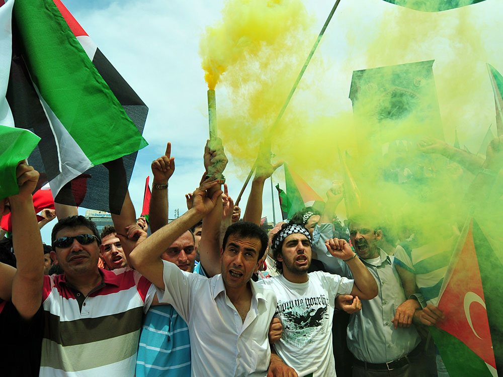 Turkish demonstrators shout slogans during an anti-Israeli
protest Turkish demonstrators shout slogans during an anti-Israeli
protest