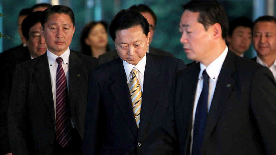 Japanese Prime Minister Yukio Hatoyama (center) leaves his official residence in Tokyo.