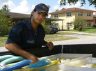 Yoelvis Bengochea works for his family business cleaning pools. Yoelvis Bengochea works for his family business cleaning pools.