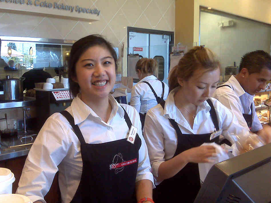 Manager Stephanie Peng stands at the counter of the 85C store in Irvine.