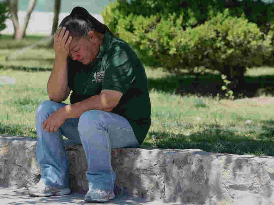 Maria Guadalupe Guerequa cries in front of the Chihuahua State Public Prosecutor's office in Juarez.