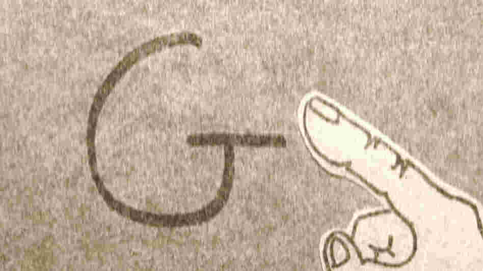 Howard traces the letter G Howard traces the letter G