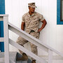 Three U.S. Marines waiting outside a building to take psychological tests Three U.S. Marines waiting outside a building to take psychological tests