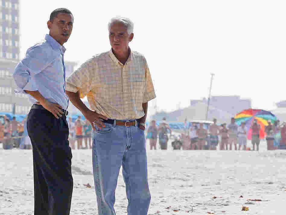 President Obama and Florida Gov. Charlie Crist walk along Casino Beach on Pensacola Beach, Fla.