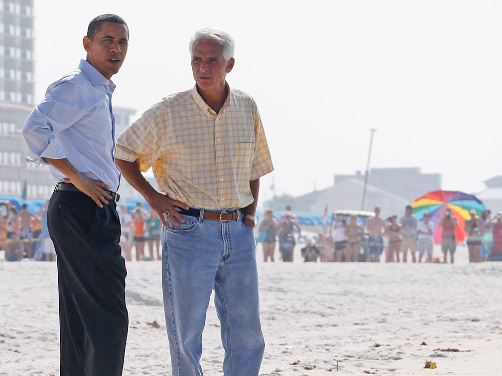 President Obama and Florida Gov. Charlie Crist walk along Casino Beach on Pensacola Beach, Fla.