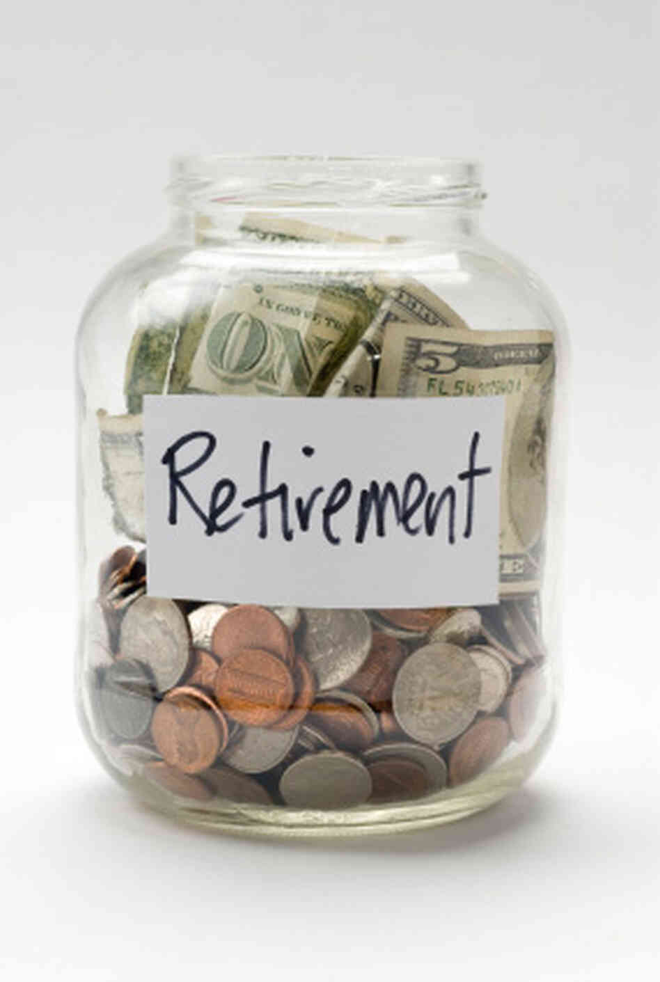 A jar full of dollars and coins marked "Retirement." A jar full of dollars and coins marked "Retirement."