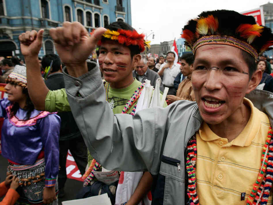 Indigenous people shout slogans during a protest.