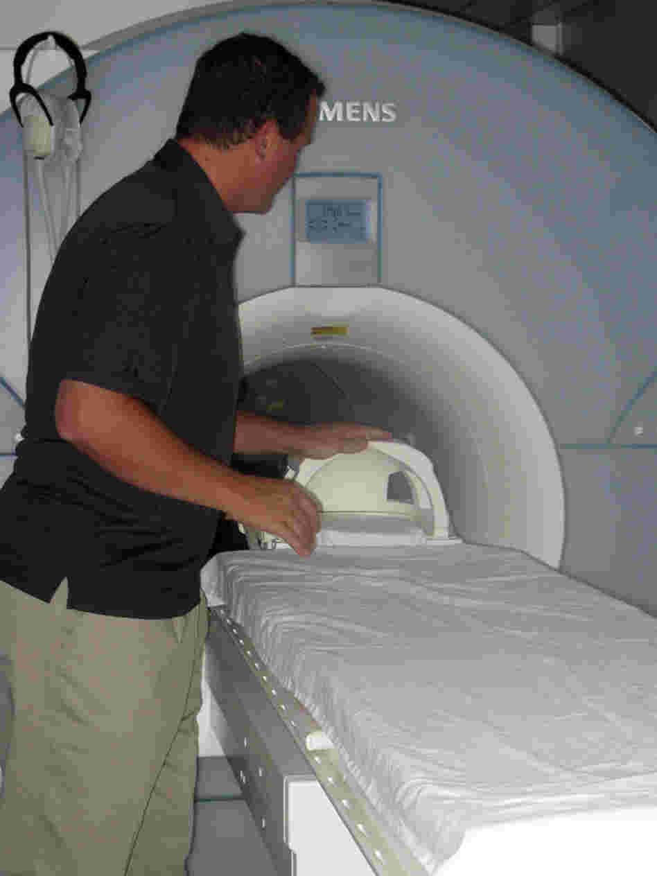 Kiehl with the brain scanner he uses at prisons Kiehl with the brain scanner he uses at prisons