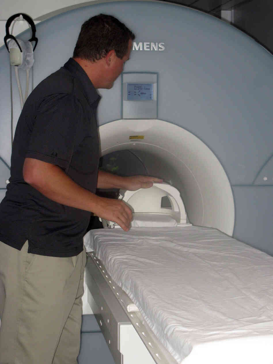 Kiehl with the brain scanner he uses at prisons Kiehl with the brain scanner he uses at prisons