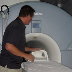 Kiehl with the brain scanner he uses at prisons. He has scanned the brains of more than 1,100 inmates, about 20 percent of whom are psychopaths.