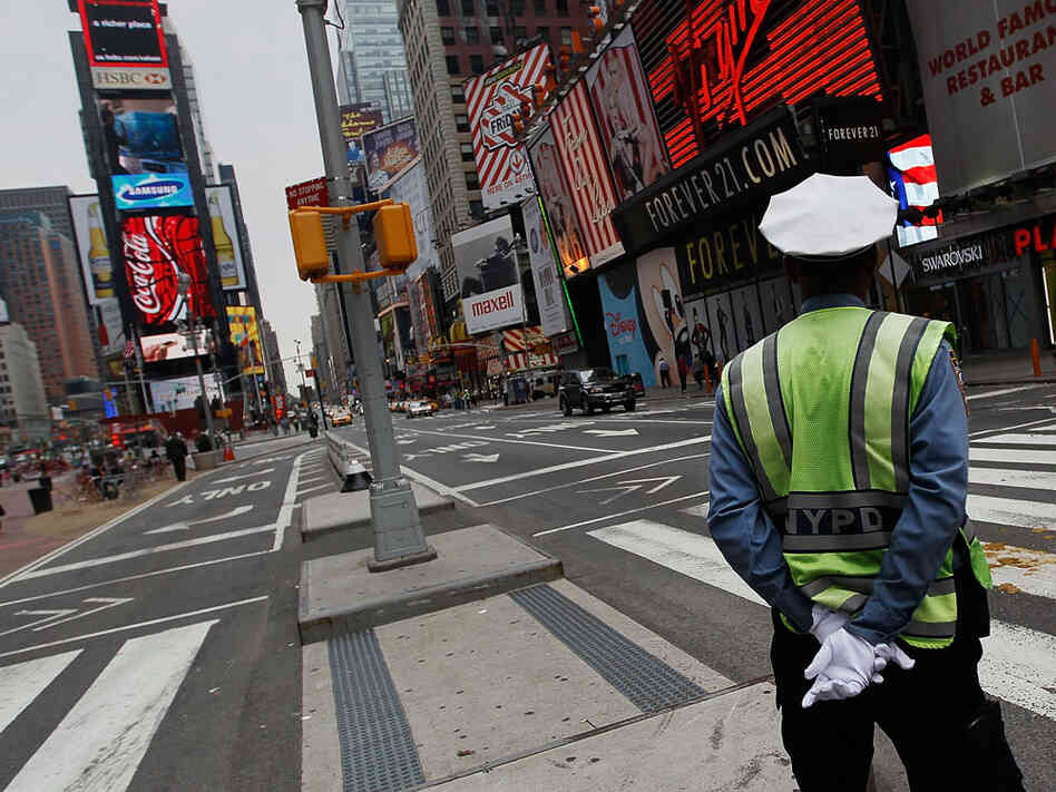 A New York City traffic policeman on his post in nearly empty Times Square