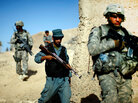 Afghan national police and U.S. soldiers on a joint patrol outside Kandahar city Afghan national police and U.S. soldiers on a joint patrol outside Kandahar city