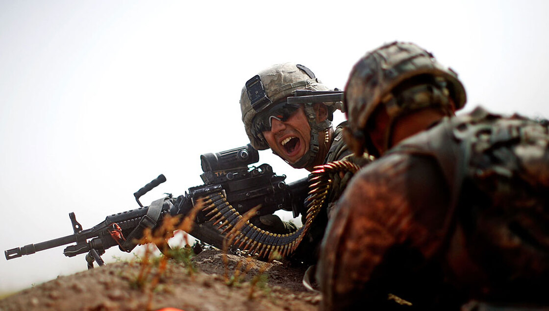 Pfc. Christopher Tolentino yells for more ammunition while under fire in Afghanistan