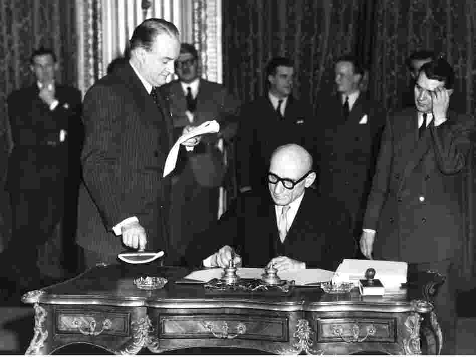 French Foreign Minister Robert Schuman signs treaty