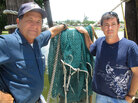 Anthony Chauvin, left, and his son, David, stand on where, until recently, they unloaded shrimp. Anthony Chauvin, left, and his son, David, stand on where, until recently, they unloaded shrimp.