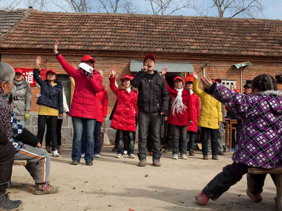 A group of young Christians proselytizes in a rural Chinese village.