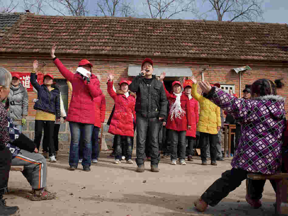 A group of traveling evangelical students sing religious songs in a rural village