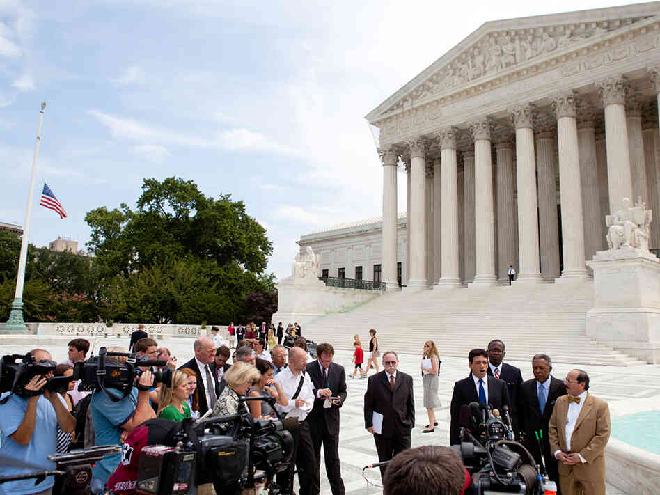 Otis McDonald and the National Rifle Association held a news conference outside the Supreme Court.