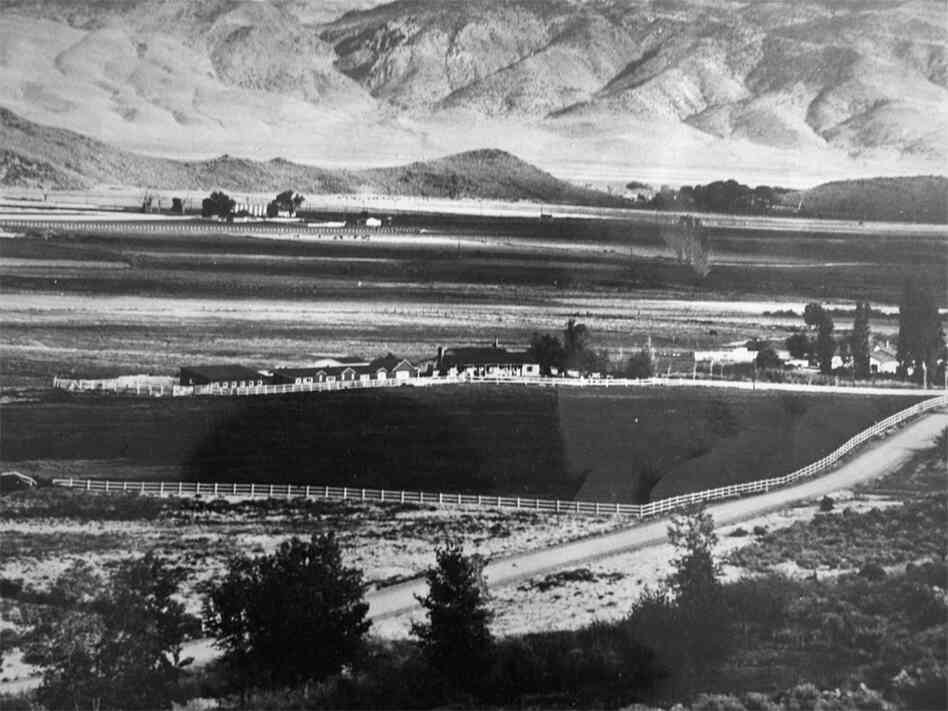 A wide view of the mountainous valley occupied by view of the Whitney Ranch (center).