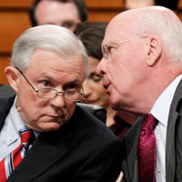 Senate Judiciary Chairman Patrick Leahy talks with ranking Republican Jeff Sessions