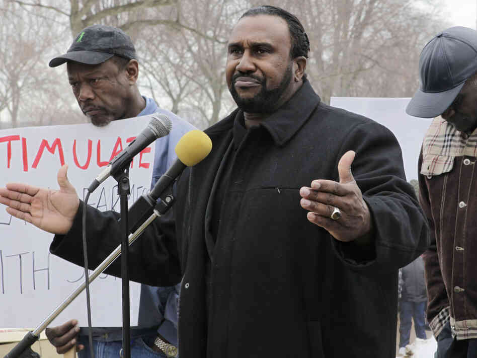 A small group of black farmers rally at the Agriculture Department