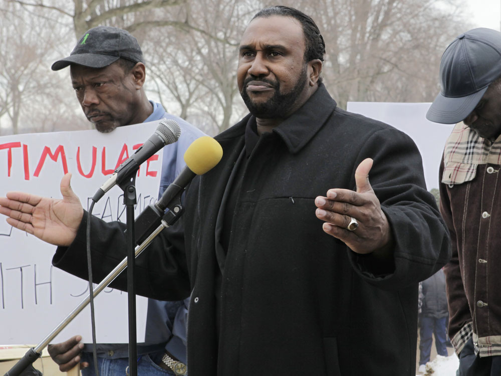 A small group of black farmers rally at the Agriculture Department