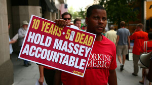 An AFL-CIO member protests outside the National Press Club on Thursday. The union wants Massey Energy CEO Don Blankenship to be held accountable in the deaths of 54 miners killed on the job in the last 10 years.