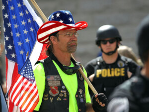 A supporter of Arizona's new immigration law at an April 23 rally in Phoenix A supporter of Arizona's new immigration law at an April 23 rally in Phoenix