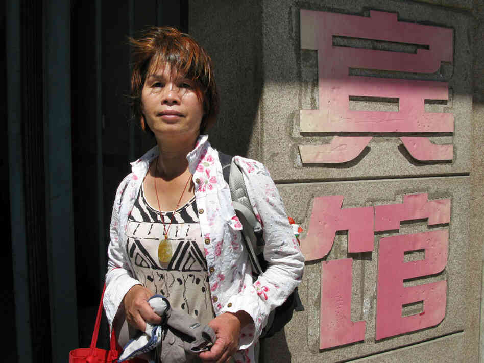 Petitioner Liu Xinyu stands outside a Beijing hotel where she was recently detained.