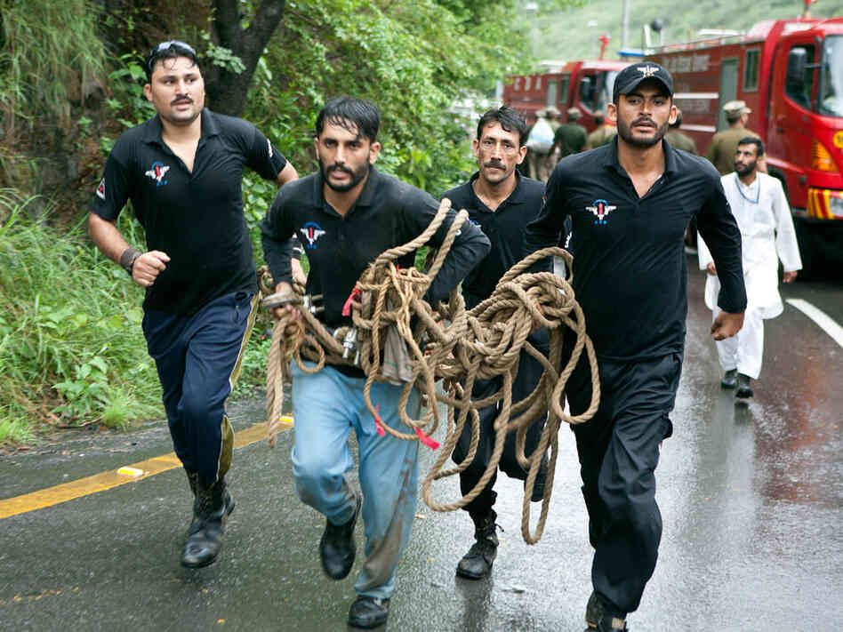 Pakistani rescue workers raced toward the crash site in the heavily forested hills.