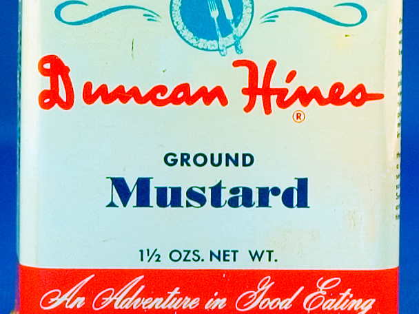 Container for Duncan Hines brand ground mustard.