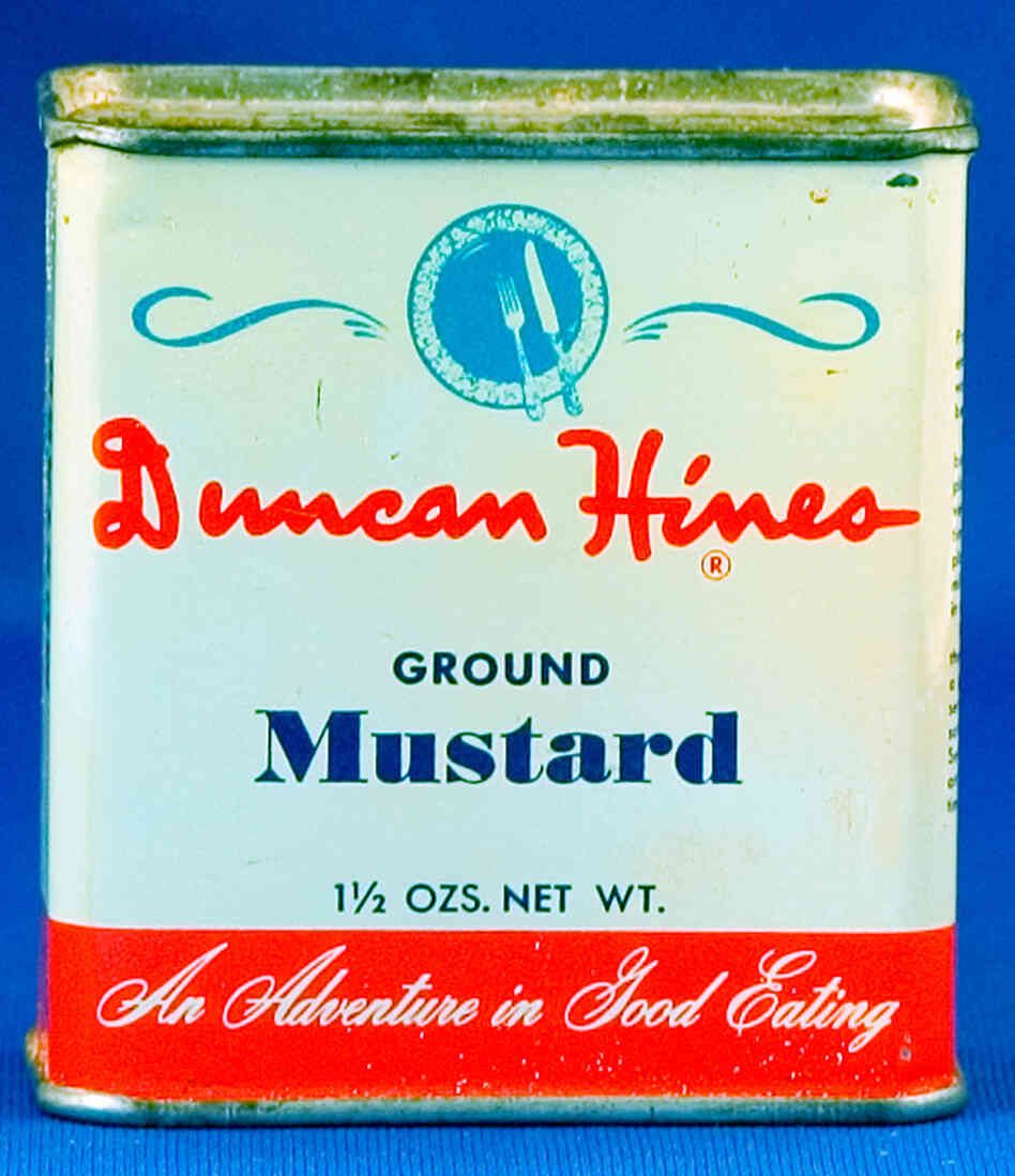 Container for Duncan Hines brand ground mustard.