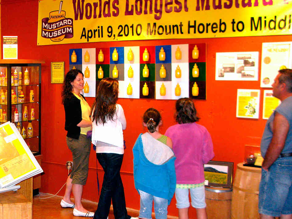 Visitors to the National Mustard Museum view displays of mustard-related art