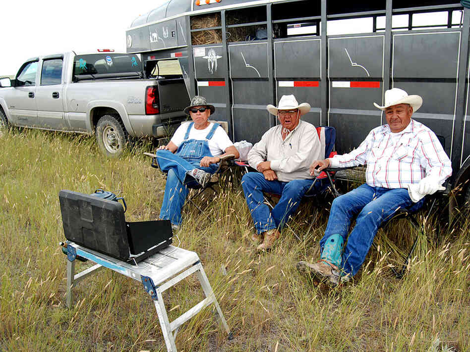 Henry Real Bird (center) takes a coffee break with Levi Bruce (right) and Sherman Sierra (left)