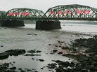 The Lower Trenton Bridge over the Delaware River reads 'Trehton Makes. The World Takes." The Lower Trenton Bridge over the Delaware River reads 'Trehton Makes. The World Takes."