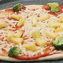 Owen Levine, 3, helps make a broccoli and pineapple pizza for Meatless Monday.