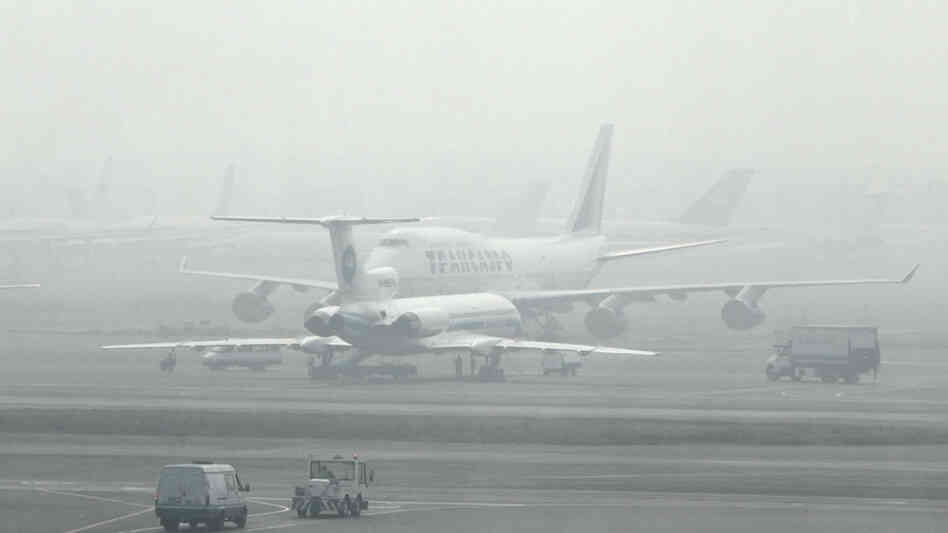Passenger planes are seen blanketed by forest fire smog Passenger planes are seen blanketed by forest fire smog