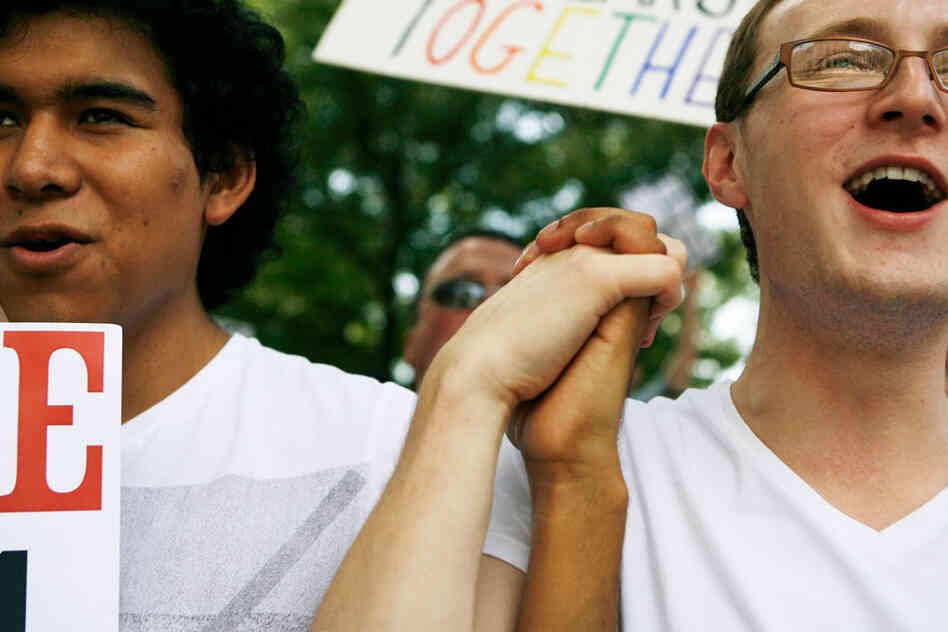 Oscar Hdez and Luke Robuck of Atlanta, who support same-sex marriage, at a silent protest Oscar Hdez and Luke Robuck of Atlanta, who support same-sex marriage, at a silent protest