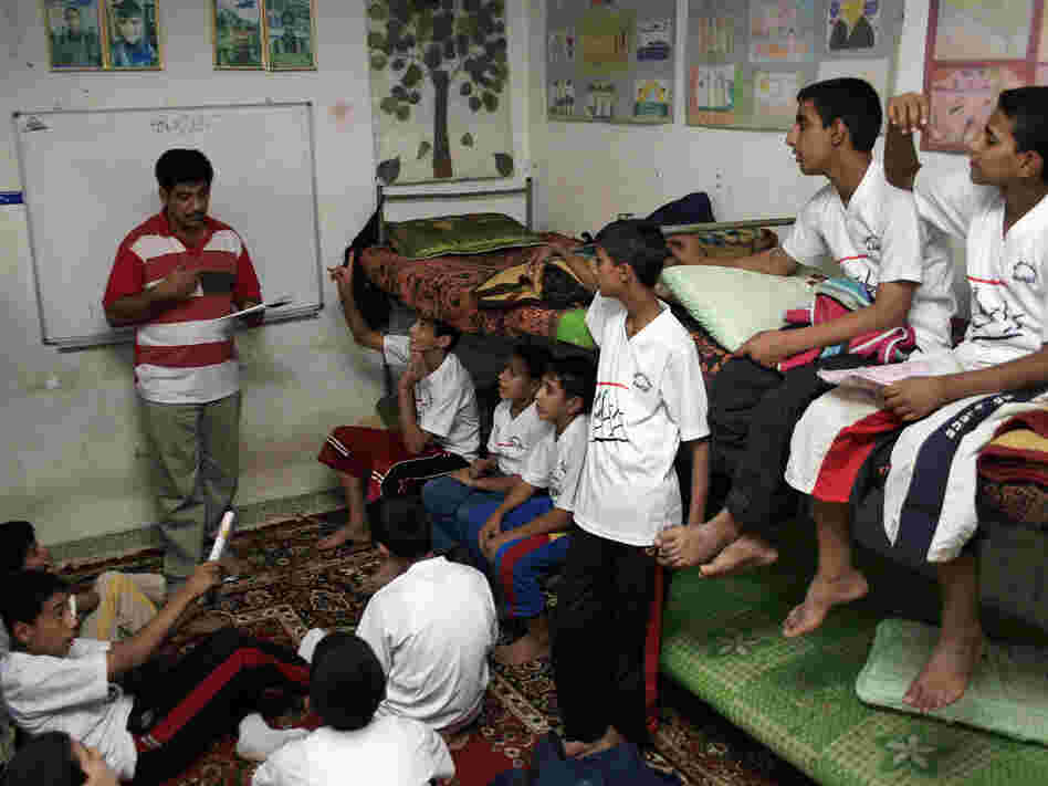 Iraqi social worker teachers orphans in Baghdad's Sadr City