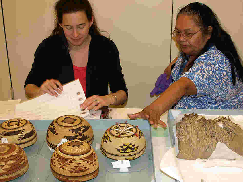 Rebecca James (right) talks with National Museum of the American Indian's Cara Fama about baskets.