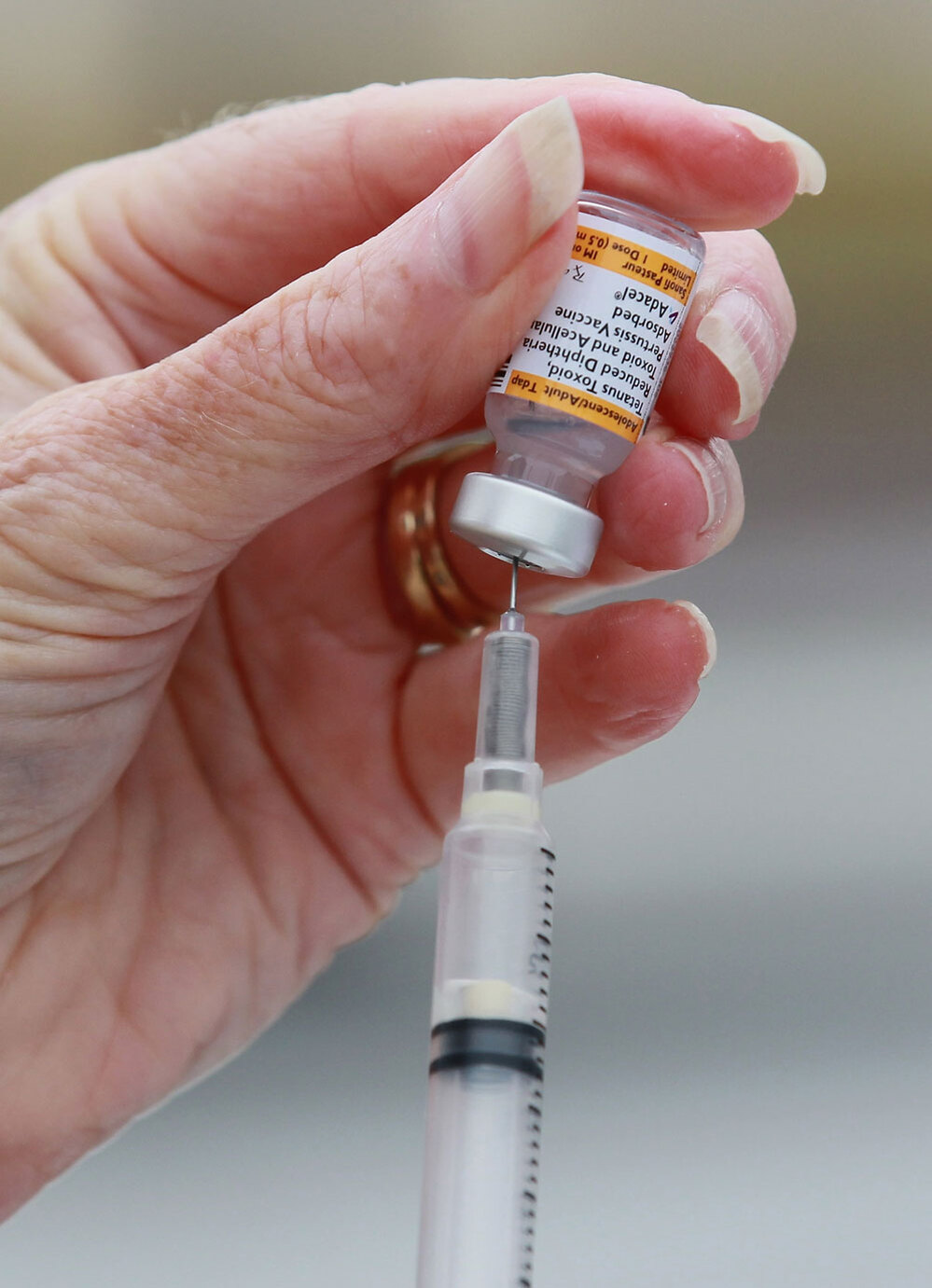 A nurse readies a whooping cough vaccination. Justin Sullivan/Getty Images