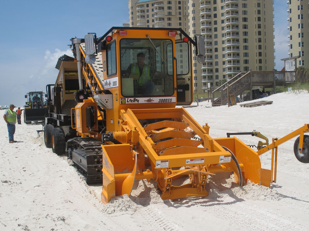 BP says the Sand Shark can clean more sand in 5 minutes than 100 people could in 3 hours.